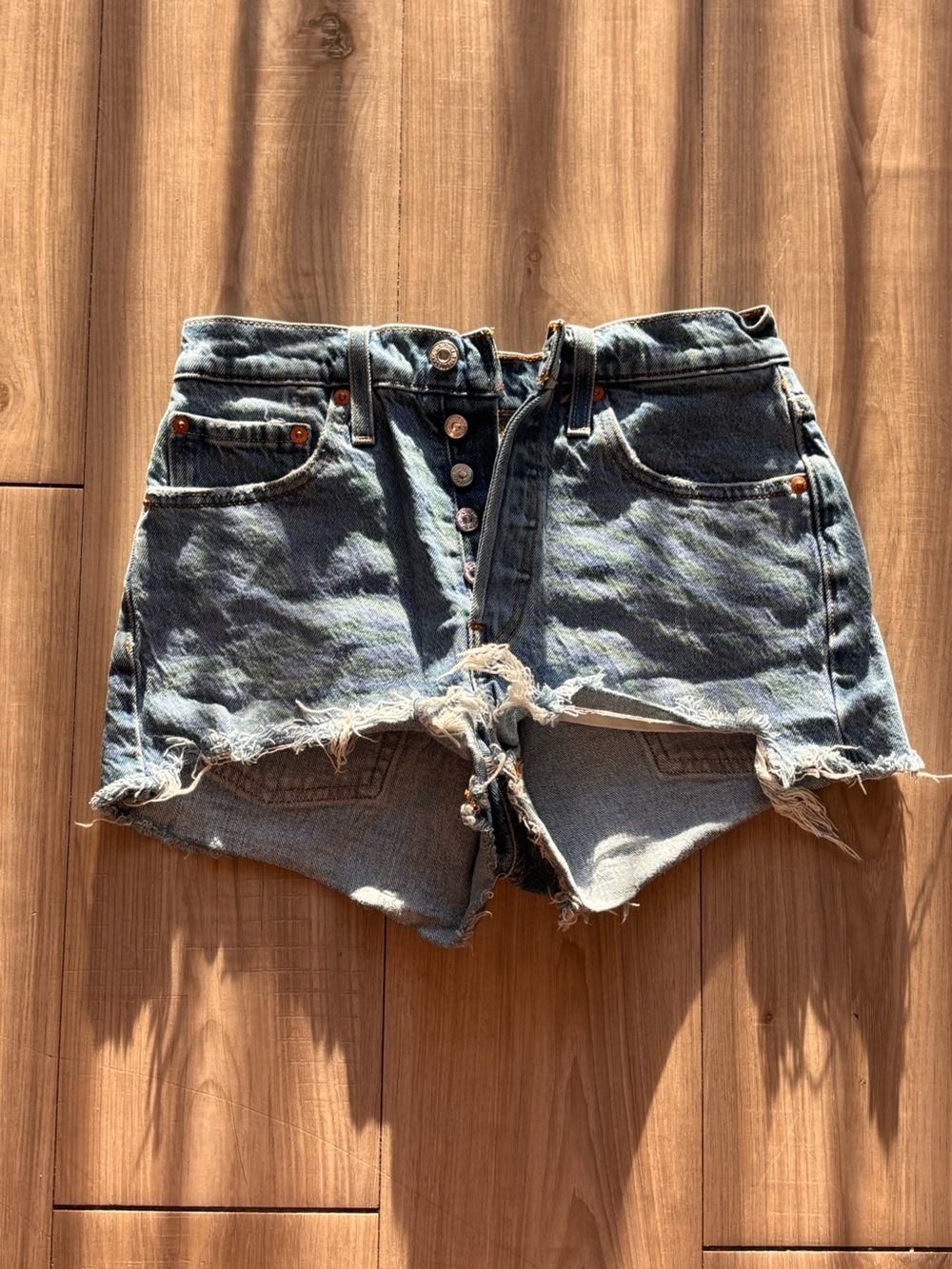 High-Rise Light Blue Distressed Denim Shorts